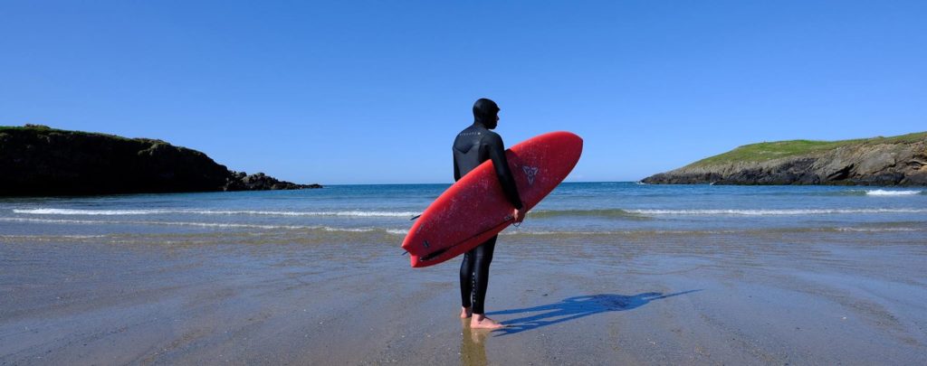 Surfing on a beach in North Wales