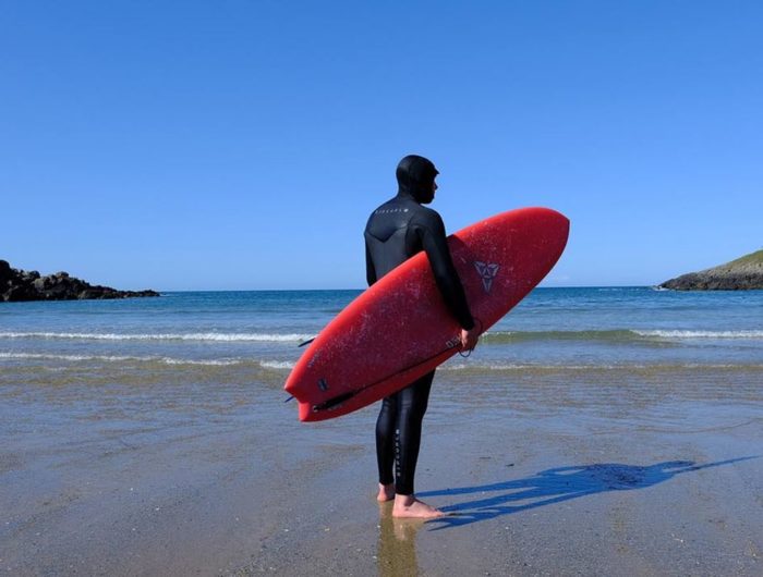 Surfing on a beach in North Wales