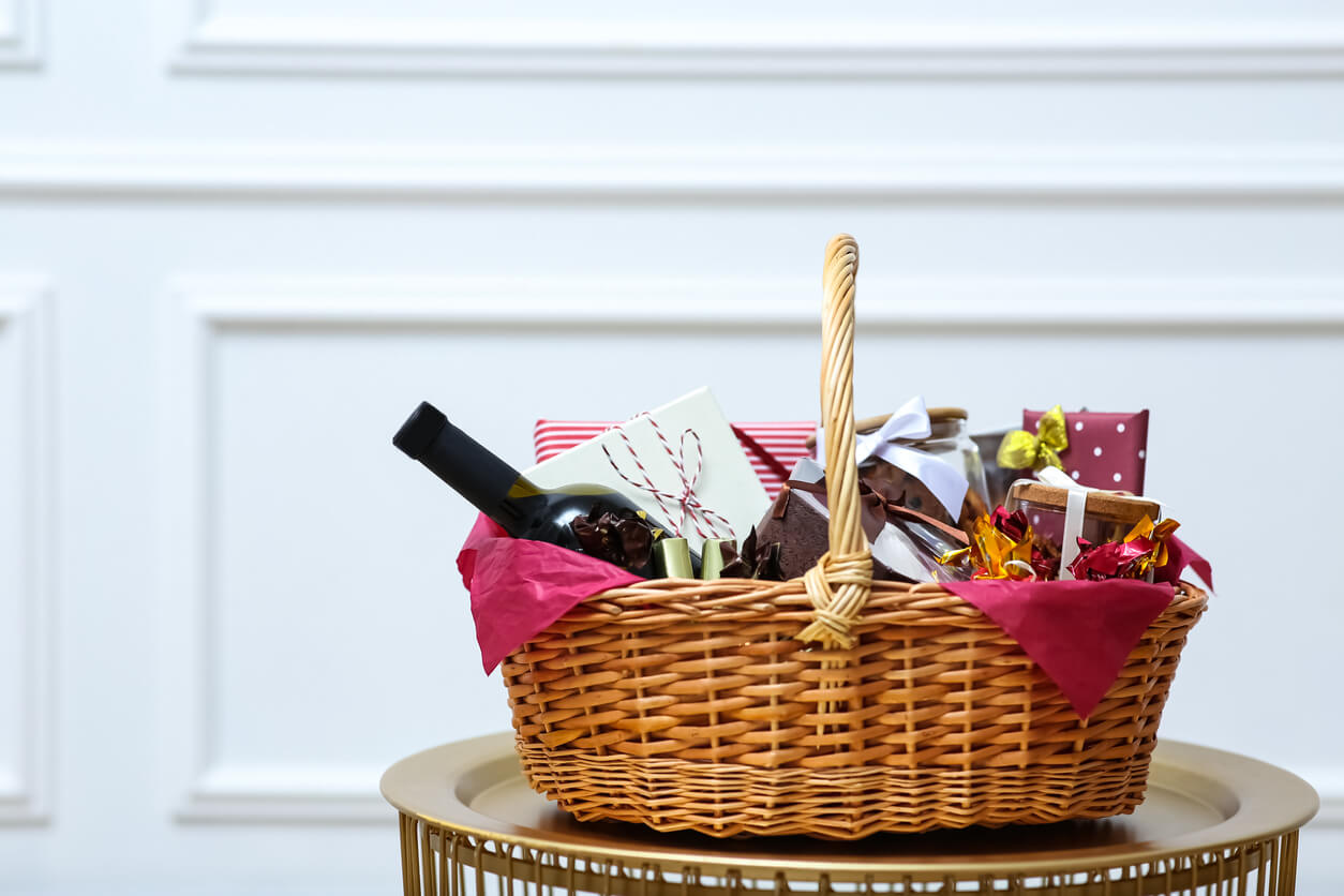 wicker basket filled with wine and treats