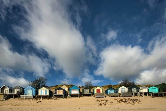 Colourful beach huts along abersoch beach