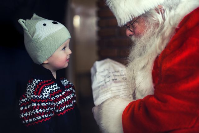 Child recieveing gift in Santa's Grotto
