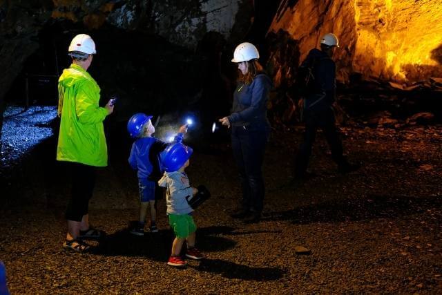 A family enjoying the Llanfair Slate Cavern tour