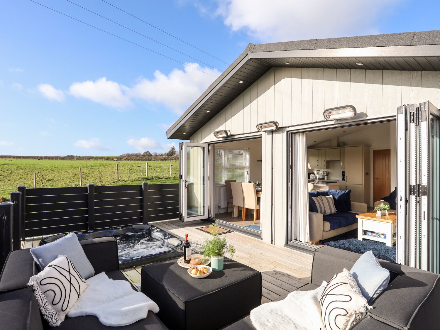 lodge in the sunshine with outdoor furniture