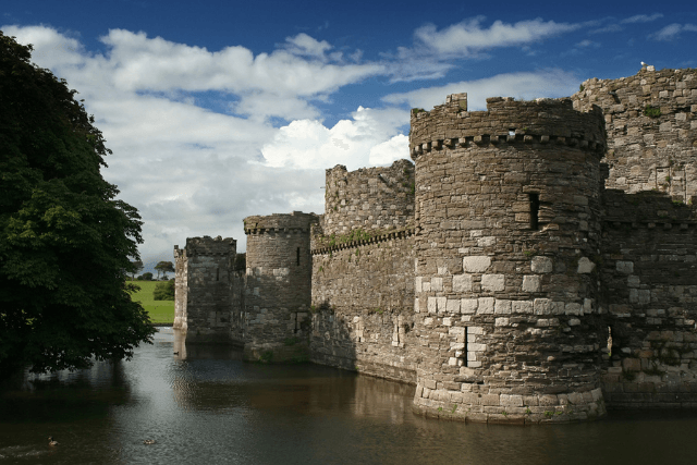 Beaumaris Castle surrounded by water.