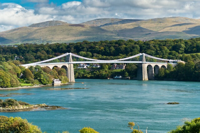View of the Menai Bridge across the Menai Strait from the Britannia Bridge in North Wales